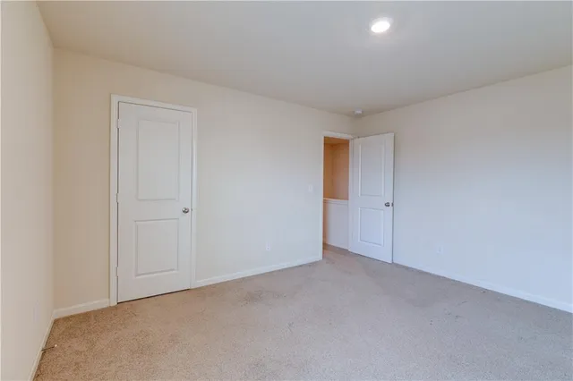 a view of an empty room and entryway