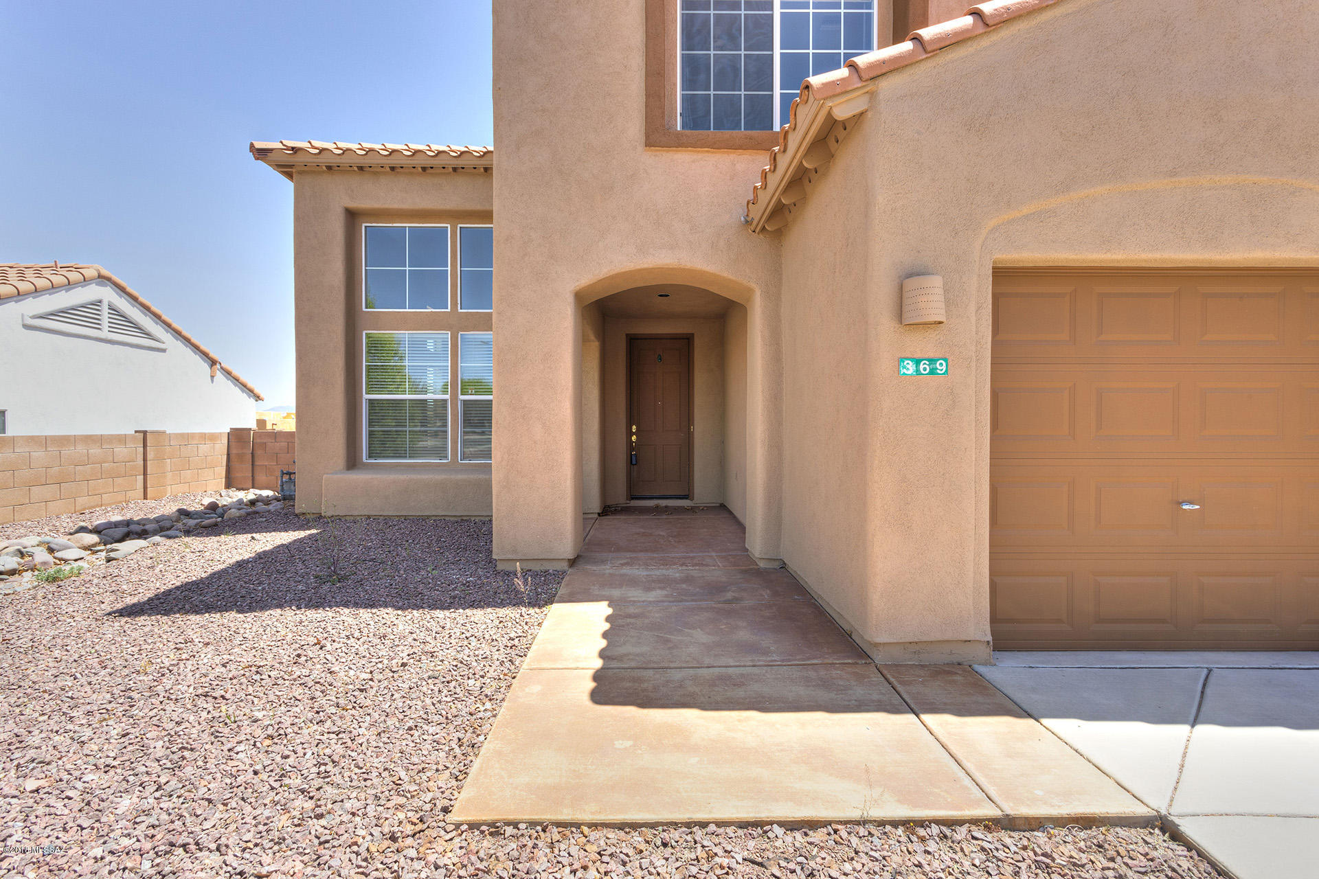 369 Via Capri Rio Rico, AZ 85648 - Photo 31 of 31 a view of a house with a door and wooden floor