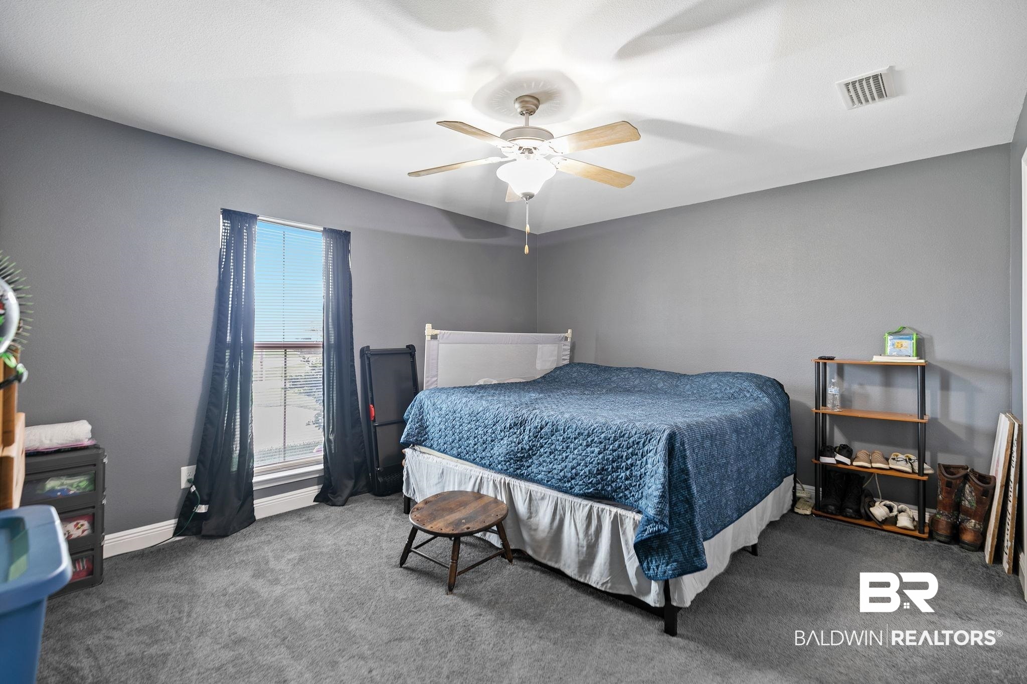 15573 Talus Court Foley, AL 36535 - Photo 22 of 50 Carpeted bedroom with ceiling fan
