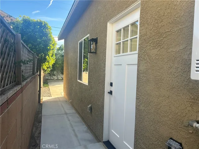 a kitchen with stainless steel appliances a refrigerator and a stove top oven