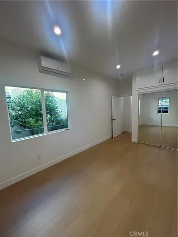 an empty room with a empty space and windows