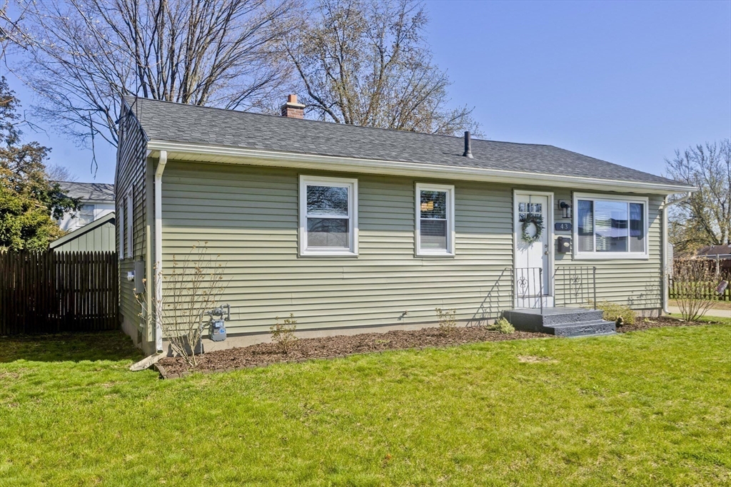 43 Rochester Street Chicopee, MA 01020 - Photo 38 of 38 a front view of a house with a yard