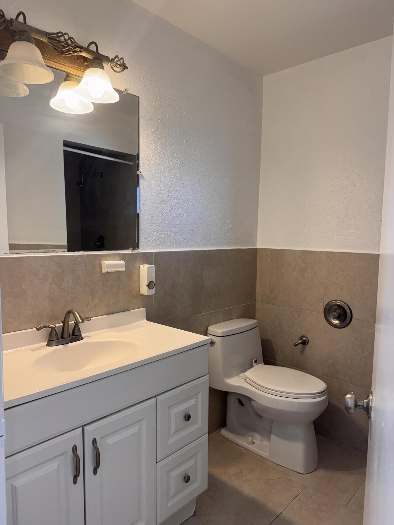 969 Plantation Road Key Largo, FL 33037 - Photo 15 of 26 a bathroom with a sink and a toilet
