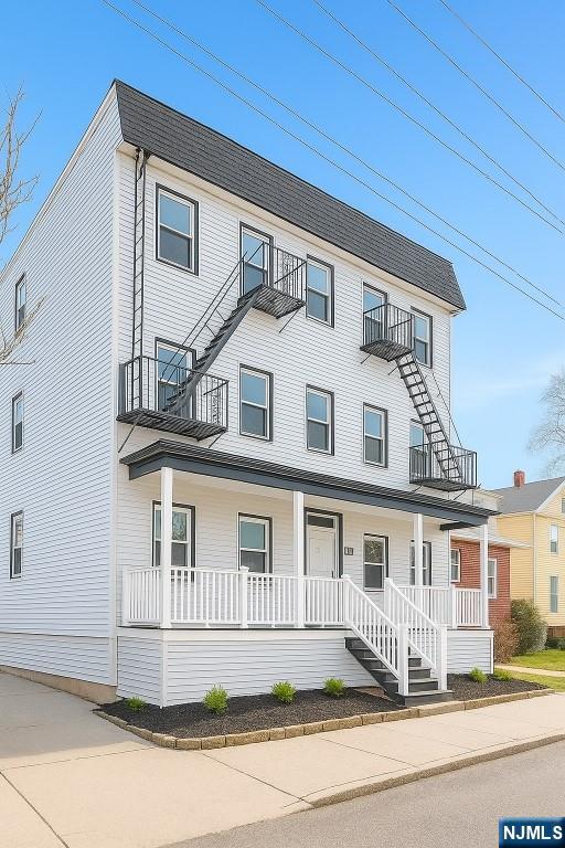 42 Lester Street Wallington, NJ 07057 - Photo 2 of 9 a front view of a house with a garden