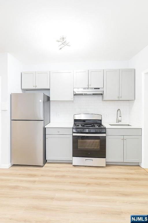 42 Lester Street Wallington, NJ 07057 - Photo 4 of 9 a kitchen with a stove and a refrigerator