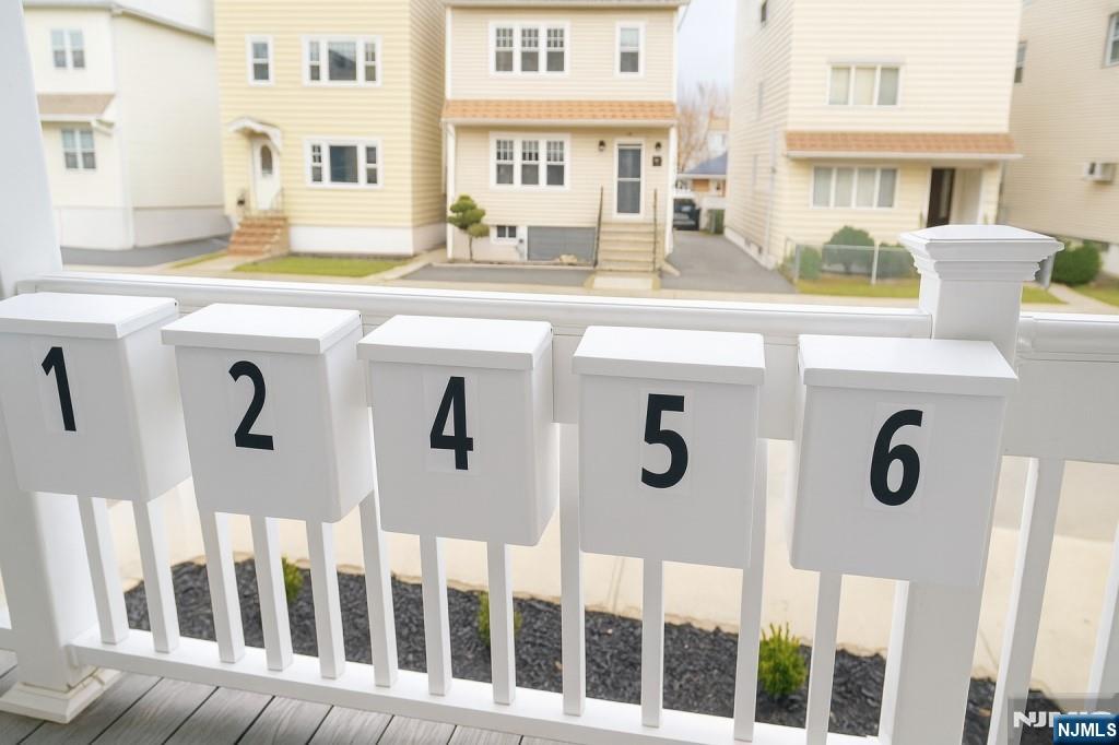 42 Lester Street Wallington, NJ 07057 - Photo 8 of 9 a front view of a building with glass windows