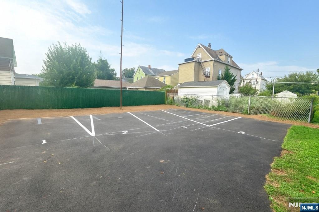 42 Lester Street Wallington, NJ 07057 - Photo 9 of 9 a view of a house with a big yard and large tree
