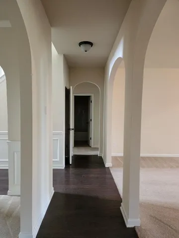 a view of a hallway with a white walls