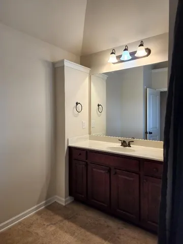 a bathroom with a sink and mirror