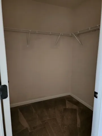 a view of an empty walk in closet