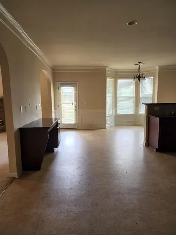 a view of a room window and wooden floor