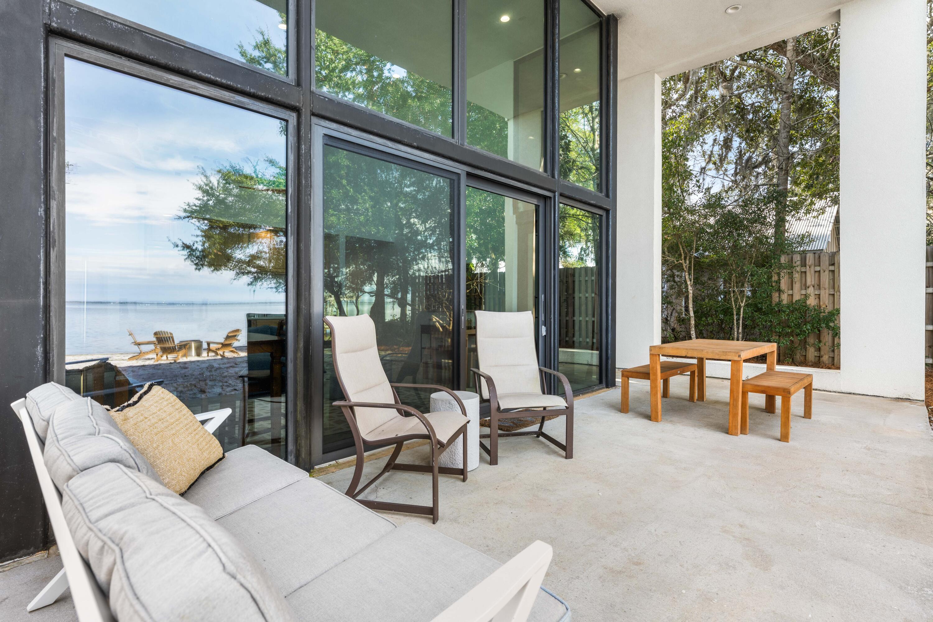 149 Native Tree Lane Santa Rosa Beach, FL 32459 - Photo 29 of 52 a outdoor living space with furniture and garden view