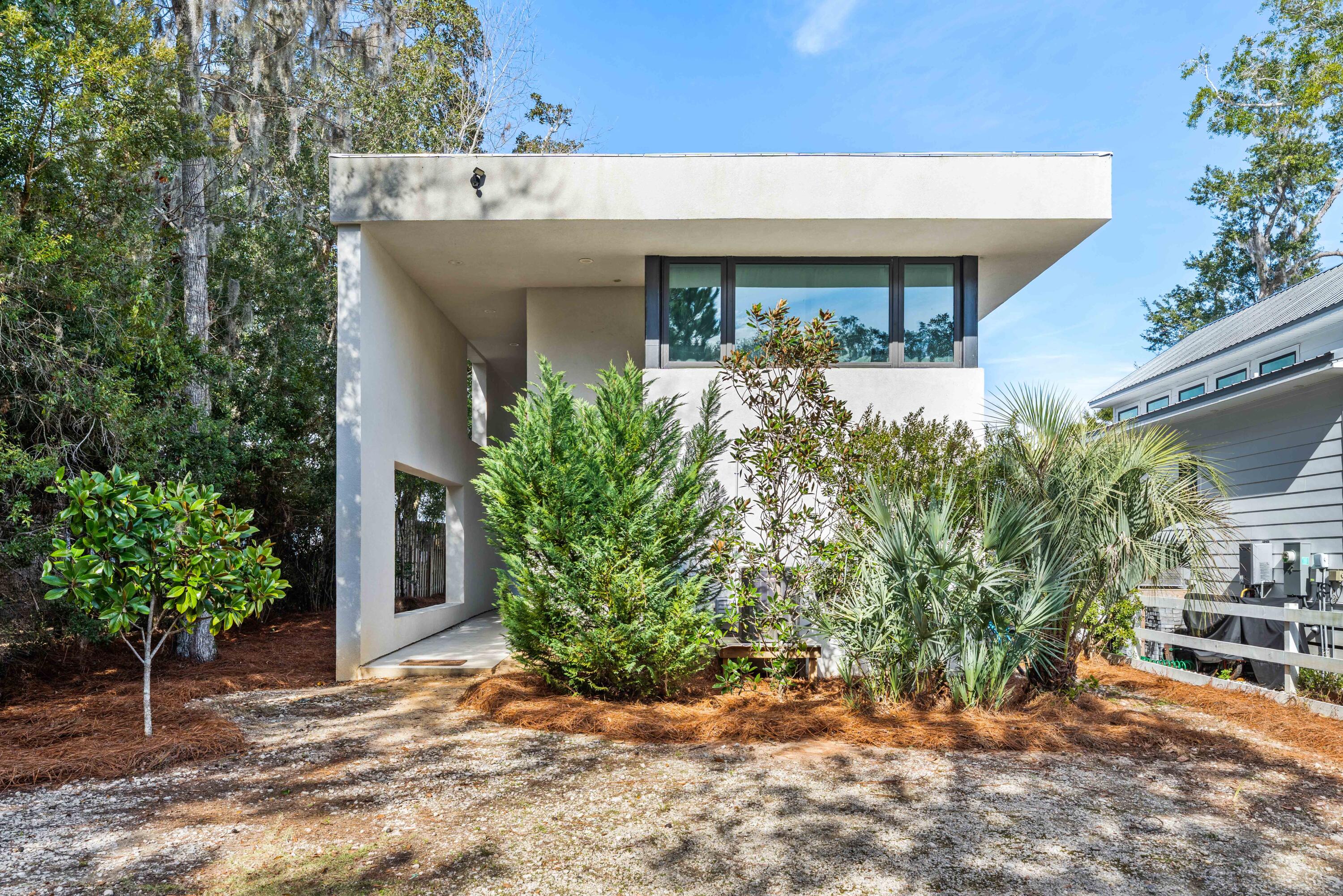 149 Native Tree Lane Santa Rosa Beach, FL 32459 - Photo 37 of 52 a front view of a house with garden