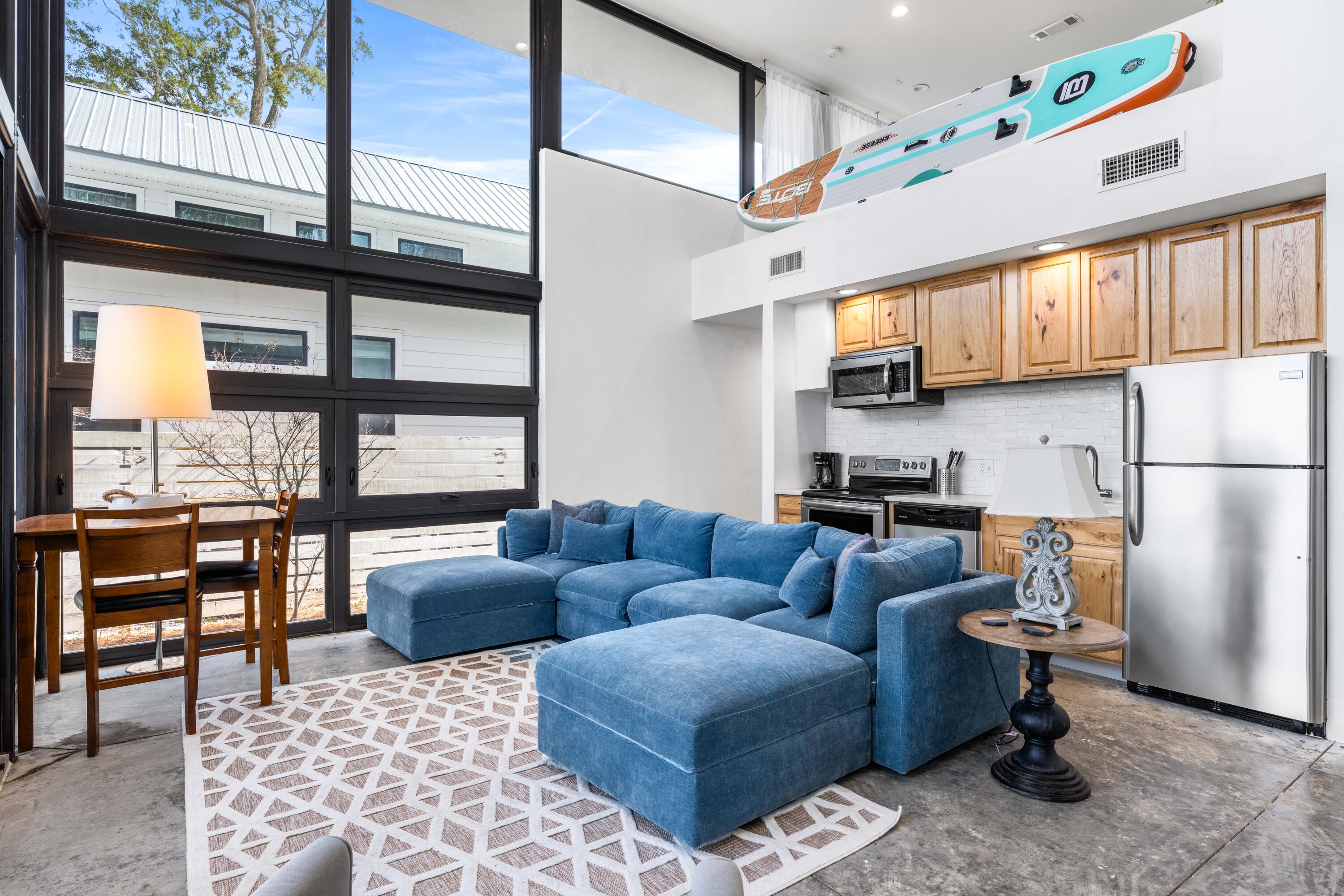 149 Native Tree Lane Santa Rosa Beach, FL 32459 - Photo 9 of 52 a living room with furniture wooden floor and a table