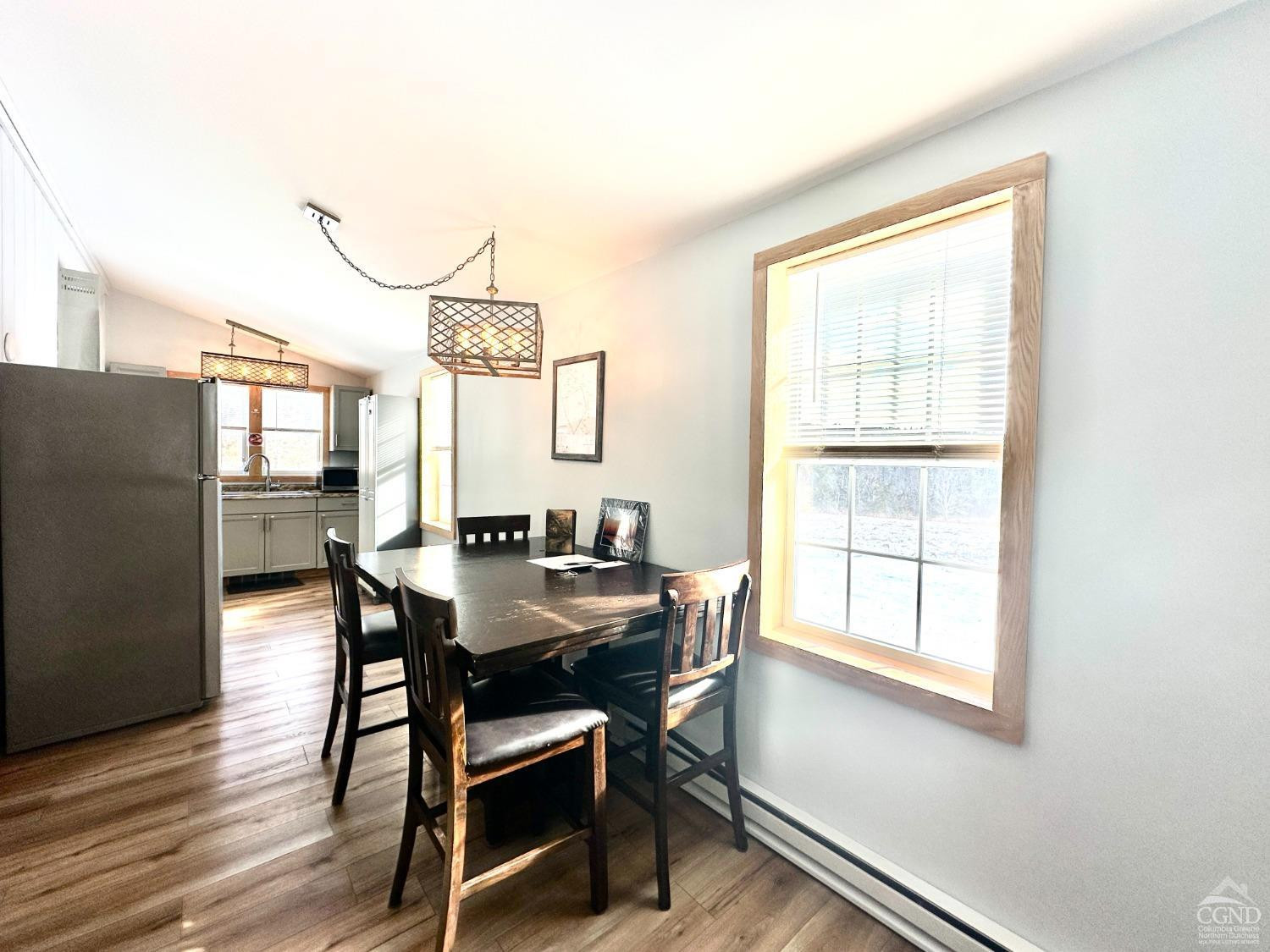 462 Dent Road Prattsville, NY 12468 - Photo 7 of 32 a view of a dining room with furniture window and wooden floor
