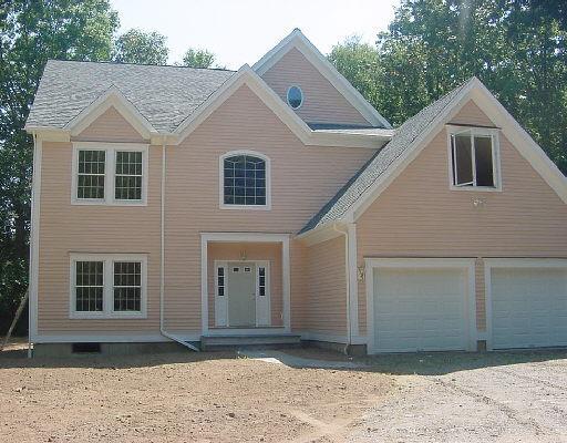 a view of a house with a backyard