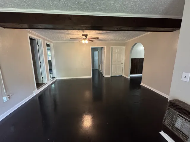 a view of a living room with wooden floor