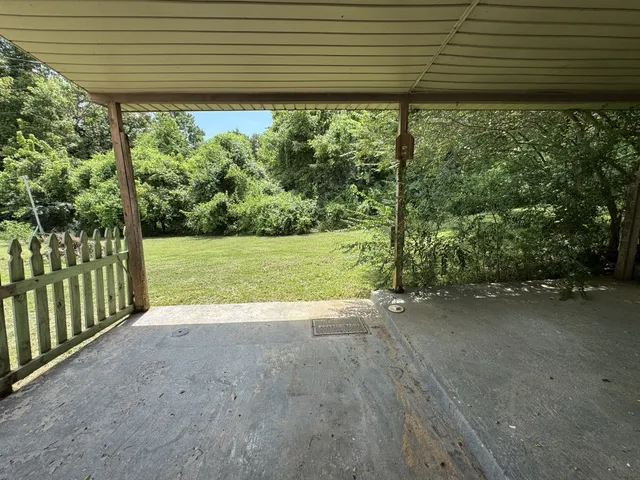 a view of a yard with an outdoor space