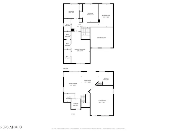 a view of a white house with a small yard and a big yard