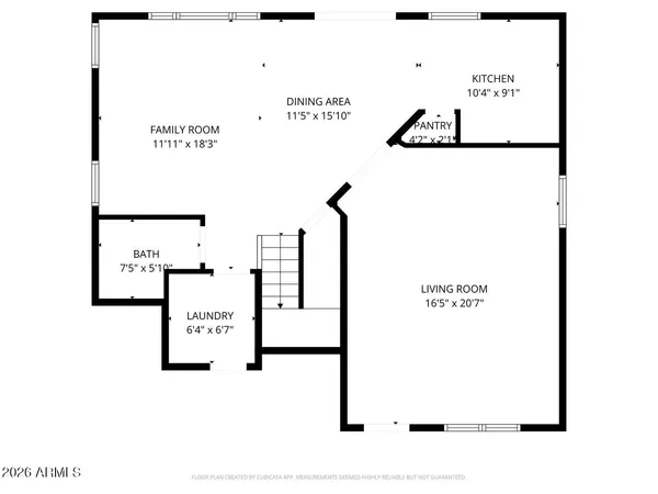 a view of a house with a yard and a large tree