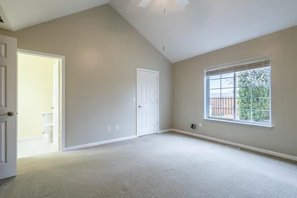 a view of an empty room with a window