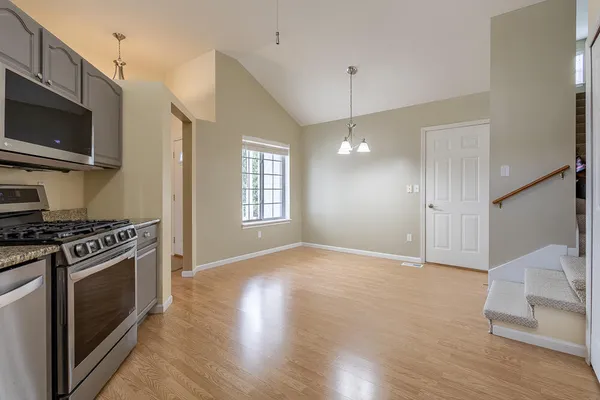 a view of kitchen with a sink and a stove top oven