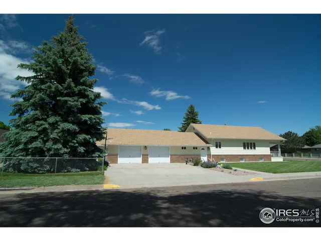 a aerial view of a house with a yard