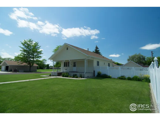 a view of a house with a big yard