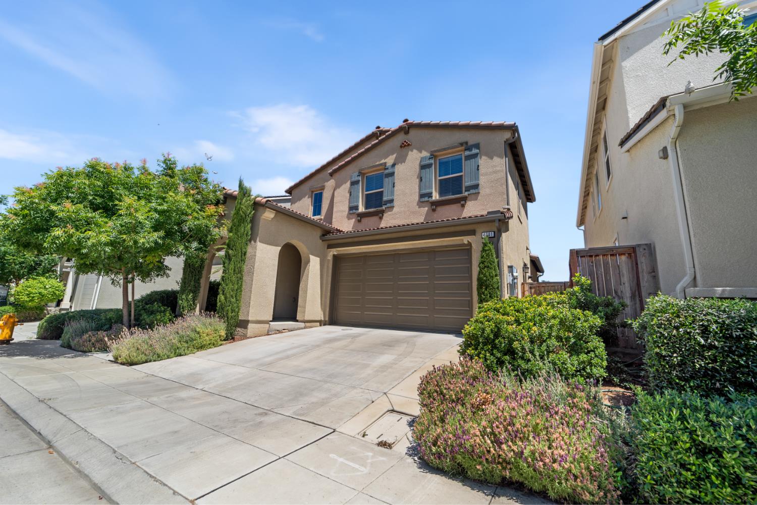 4301 San Miguel Road Madera, CA 93636 - Photo 48 of 60 a front view of a house with a yard and garage