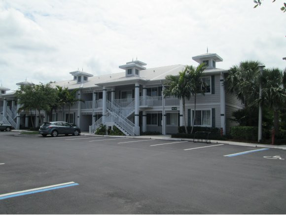 a front view of a building with many windows