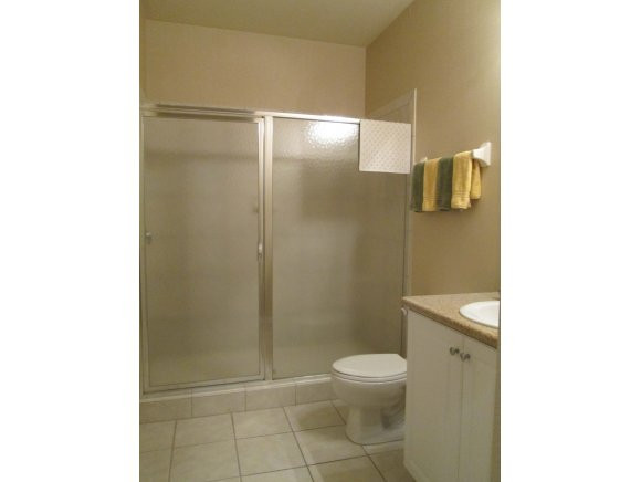 7920 Mahogany Run Lane, Unit 1024 Naples, FL 34113 - Photo 14 of 18 a bathroom with a toilet and a shower