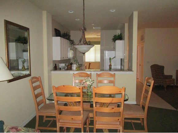 7920 Mahogany Run Lane, Unit 1024 Naples, FL 34113 - Photo 8 of 18 a view of a dining room with furniture