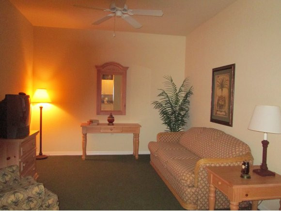 7920 Mahogany Run Lane, Unit 1024 Naples, FL 34113 - Photo 10 of 18 a bedroom with a bed and a couch