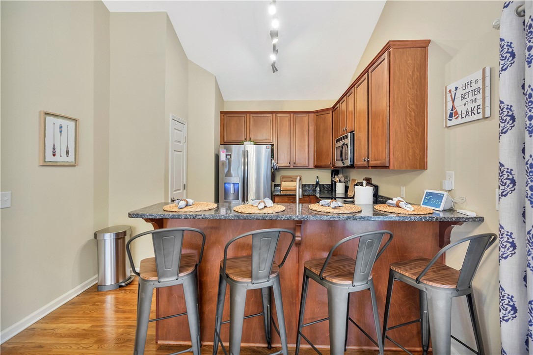 101 Riviera Circle Anderson, SC 29621 - Photo 14 of 35 This inviting kitchen features rich wood cabinetry and a functional breakfast bar perfect for casual dining.