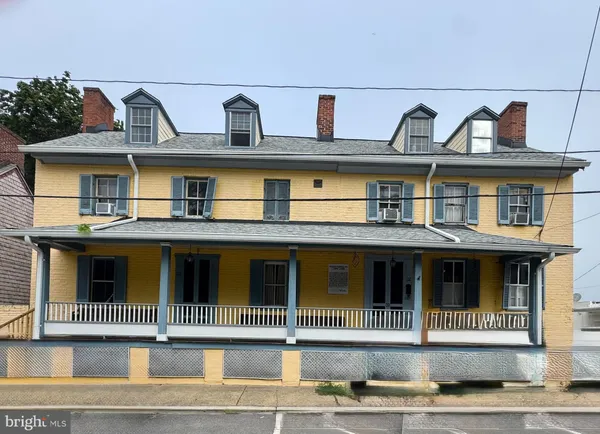 a view of a white building among the street
