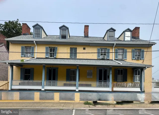 a view of a white building among the street