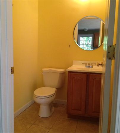 13 Wrentham Road Worcester, MA 01602 - Photo 13 of 18 a bathroom with a toilet sink and mirror
