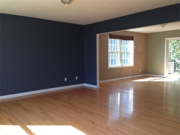 13 Wrentham Road Worcester, MA 01602 - Photo 15 of 18 a view of an empty room with wooden floor and a window