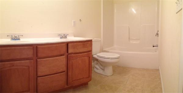 13 Wrentham Road Worcester, MA 01602 - Photo 17 of 18 a bathroom with a sink a toilet and shower