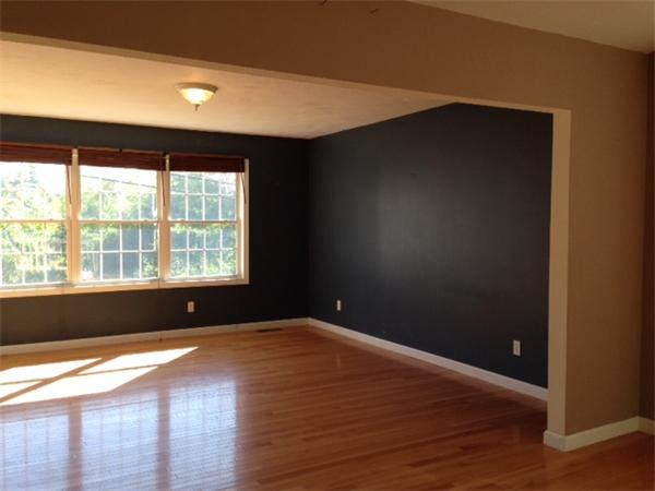 13 Wrentham Road Worcester, MA 01602 - Photo 9 of 18 an empty room with wooden floor and windows