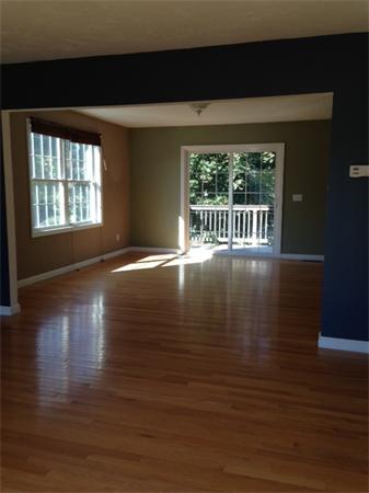 13 Wrentham Road Worcester, MA 01602 - Photo 10 of 18 a view of a room with wooden floor and a window