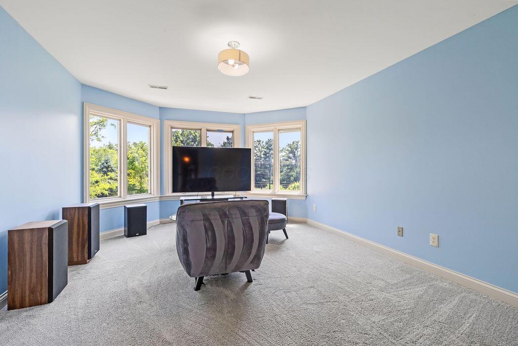 2570 Jewett Road Powell, OH 43065 - Photo 56 of 104 • Grey carpet • Blue painted walls • Ceiling light • Bay wall • Closet with french doors • Jack & Jill bath access
