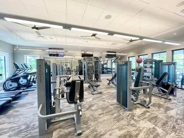 a view of a dining room with furniture wooden floor and chandelier