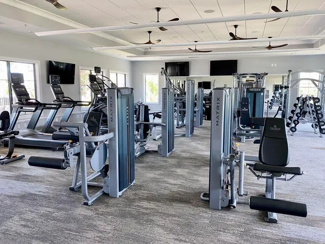 a view of a chairs and tables in a patio