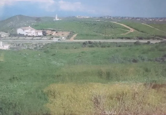 a view of a field with an trees