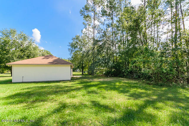 144 Brickyard Road Middleburg, FL 32068 - Photo 14 of 17 a view of a house with a yard