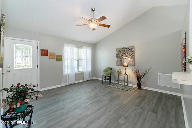 144 Brickyard Road Middleburg, FL 32068 - Photo 2 of 17 a living room with furniture and wooden floor