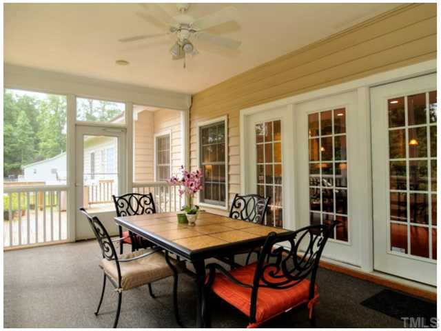 2809 Cowley Road Cary, NC 27518 - Photo 15 of 25 Large Screened Porch getting new outdoor carpet, Ceiling Fan and Built in Speakers. Screened Porch