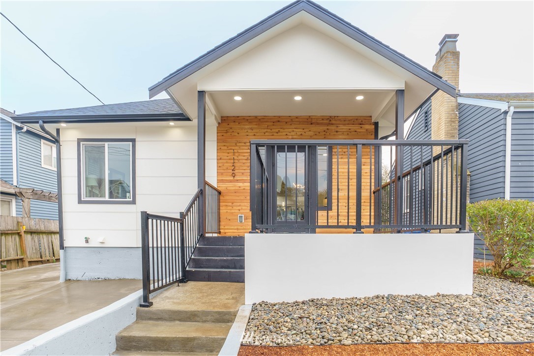 1129 North 84th Street Seattle, WA 98103 - Photo 1 of 24 a view of entryway and hall with wooden floor