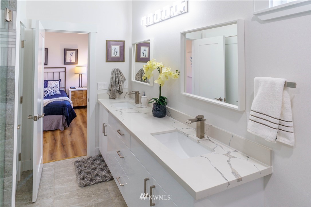 1129 North 84th Street Seattle, WA 98103 - Photo 12 of 24 a bathroom with a sink and a mirror